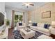 Bright living room featuring stylish decor, a ceiling fan, and access to an outdoor balcony at 215 Semel Nw Dr # 466, Atlanta, GA 30309