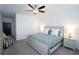 Relax in this bedroom with a ceiling fan, plush carpet, and two windows at 227 Atley Pl, Alpharetta, GA 30009