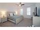 Relax in this bedroom with a ceiling fan, plush carpet, and two windows at 227 Atley Pl, Alpharetta, GA 30009