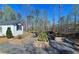 Community garden with raised planting beds and shed, set in a wooded location at 227 Atley Pl, Alpharetta, GA 30009