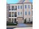Charming townhome with brick facade, two-car garage, and inviting covered balconies at 227 Atley Pl, Alpharetta, GA 30009