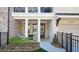 Inviting front porch with fire pit and seating area perfect for relaxing outdoors at 227 Atley Pl, Alpharetta, GA 30009
