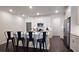 Modern kitchen featuring stainless steel appliances, white cabinets, and an island with bar seating at 227 Atley Pl, Alpharetta, GA 30009