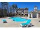Community pool area with lounge chairs and well maintained landscaping at 227 Atley Pl, Alpharetta, GA 30009