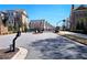 Street view of homes in a gated community with mature trees and landscaping at 227 Atley Pl, Alpharetta, GA 30009