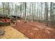 Large backyard with mature trees, a gazebo, and an area for enjoying the outdoors at 4057 Watkins Glen Dr, Woodstock, GA 30189