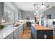 Updated kitchen featuring gray cabinets, stainless steel appliances, and a butcher block island at 4057 Watkins Glen Dr, Woodstock, GA 30189