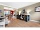 Open-concept living room and dining area featuring hardwood floors and ample natural light at 4057 Watkins Glen Dr, Woodstock, GA 30189