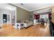 Spacious living spaces featuring hardwood floors, a dining area, and an office space with custom built-ins at 4057 Watkins Glen Dr, Woodstock, GA 30189