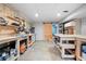 Basement workshop with multiple workbenches and storage at 4057 Watkins Glen Dr, Woodstock, GA 30189