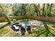 Backyard features outdoor seating, a patio, lush landscaping, and a privacy fence at 576 Quillian Ave, Decatur, GA 30032