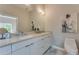 Modern bathroom featuring a double sink vanity with sleek countertops and contemporary fixtures at 576 Quillian Ave, Decatur, GA 30032