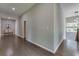 Hallway with hardwood floors, natural light, and neutral walls, connecting various living spaces seamlessly at 576 Quillian Ave, Decatur, GA 30032