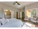 Serene main bedroom with hardwood floors, a ceiling fan, and multiple entryways at 576 Quillian Ave, Decatur, GA 30032