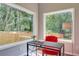 Bright home office with large windows, a modern desk, and a comfortable chair for focused productivity at 576 Quillian Ave, Decatur, GA 30032