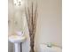 Bright half bathroom featuring modern sink and decorative accents, offering style and convenience at 2580 Brittany Park Cv, Ellenwood, GA 30294