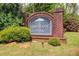 Brittany Park neighborhood sign surrounded by lush greenery on a sunny day at 2580 Brittany Park Cv, Ellenwood, GA 30294
