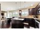 Spacious open kitchen with granite countertops, kitchen island, stainless steel appliances and view to dining room at 2580 Brittany Park Cv, Ellenwood, GA 30294