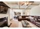 Open living space with fireplace, view to kitchen, and coffered ceiling at 2580 Brittany Park Cv, Ellenwood, GA 30294