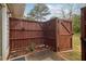 Private fenced-in back patio with space for seating and outdoor relaxation at 4988 Meadow Ln, Marietta, GA 30068