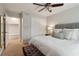Comfortable bedroom with accent bench, bright lighting, and organized closet space at 4988 Meadow Ln, Marietta, GA 30068