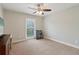 Neutral bedroom with ceiling fan, light walls, window with blinds, and closet at 4988 Meadow Ln, Marietta, GA 30068