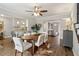 Open-concept dining room featuring hardwood floors and seamless transition to living area at 4988 Meadow Ln, Marietta, GA 30068