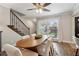Charming dining room featuring hardwood floors, staircase, and natural light from the window at 4988 Meadow Ln, Marietta, GA 30068