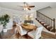 Bright dining room with wood floors and a staircase at 4988 Meadow Ln, Marietta, GA 30068