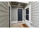 Inviting entrance with a welcoming mat, and classic door for immediate access at 4988 Meadow Ln, Marietta, GA 30068