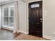 Elegant entry door with decorative glass and a stylish zebra-patterned rug, bathed in natural light at 4988 Meadow Ln, Marietta, GA 30068