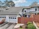Charming townhome with a garage and a cozy fenced front yard with well-maintained landscaping at 4988 Meadow Ln, Marietta, GA 30068