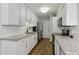 Well-equipped kitchen with white cabinets, granite countertops, and stainless steel appliances at 4988 Meadow Ln, Marietta, GA 30068