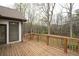 Wooden back deck overlooking wooded backyard at 5233 Hayden Farms Dr, Powder Springs, GA 30127