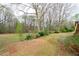 Lawn with trees, and landscaping at 5233 Hayden Farms Dr, Powder Springs, GA 30127