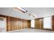 Unfinished basement features wood paneling and two windows at 5233 Hayden Farms Dr, Powder Springs, GA 30127