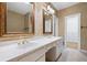 Bathroom featuring double sink vanity, framed mirrors and custom wallpaper at 5233 Hayden Farms Dr, Powder Springs, GA 30127