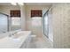 Full bathroom featuring a single sink vanity and a shower with glass doors at 5233 Hayden Farms Dr, Powder Springs, GA 30127