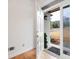 Light and bright entryway showcases hardwood floors and a charming view of the outdoors at 5233 Hayden Farms Dr, Powder Springs, GA 30127