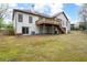 The backyard reveals a deck overlooking a verdant, expansive lawn at 5233 Hayden Farms Dr, Powder Springs, GA 30127