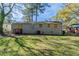 A spacious backyard with potential for gardening, play, and outdoor entertaining at 388 Belgarde Se Pl, Atlanta, GA 30354