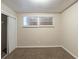 Bedroom features neutral paint, closet and large windows at 388 Belgarde Se Pl, Atlanta, GA 30354