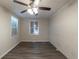 A bright bedroom is enhanced by a brick wall, ceiling fan, and modern flooring at 388 Belgarde Se Pl, Atlanta, GA 30354