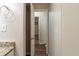 Hallway with wood floors and a view into another room through an open door at 388 Belgarde Se Pl, Atlanta, GA 30354