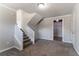 Finished basement showcasing carpet flooring, neutral walls, stairs, and access to a closet at 5224 Sweet Air Ln, Stone Mountain, GA 30088