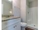Bathroom featuring a granite vanity, toilet, and shower with modern fixtures at 5224 Sweet Air Ln, Stone Mountain, GA 30088