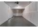 Spacious garage with a concrete floor, white walls, and ample space for parking and storage at 5224 Sweet Air Ln, Stone Mountain, GA 30088