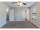 The main bedroom has carpet flooring, neutral walls, and adjoining bathroom and closet at 5224 Sweet Air Ln, Stone Mountain, GA 30088