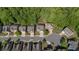Wide aerial view showcasing homes with mature trees, sidewalks, and street parking at 557 Winder Trl, Canton, GA 30114