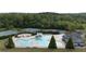 Aerial shot of the community pool, tennis courts, and playground at 557 Winder Trl, Canton, GA 30114